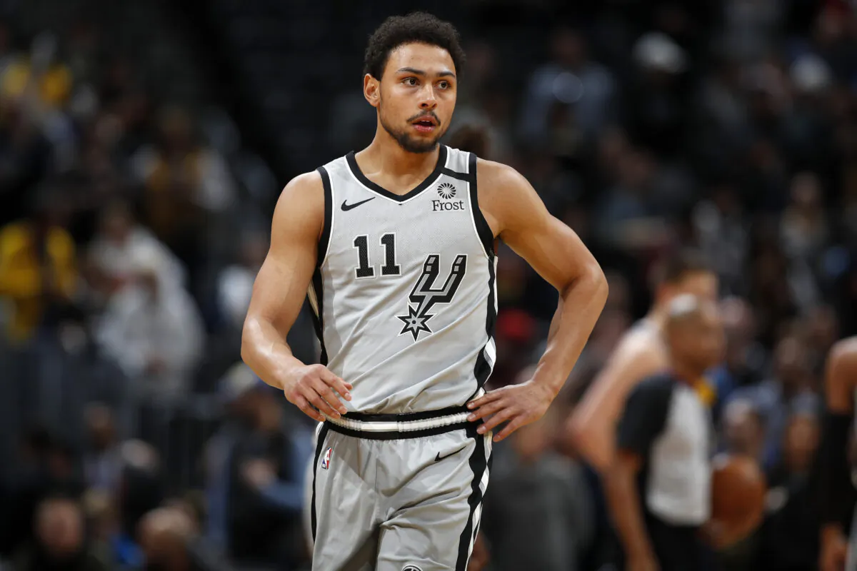 San Antonio Spurs guard Bryn Forbes (11) watches during the first half of an NBA basketball game in Denver on Feb. 10, 2020. (David Zalubowski/AP Photo)
