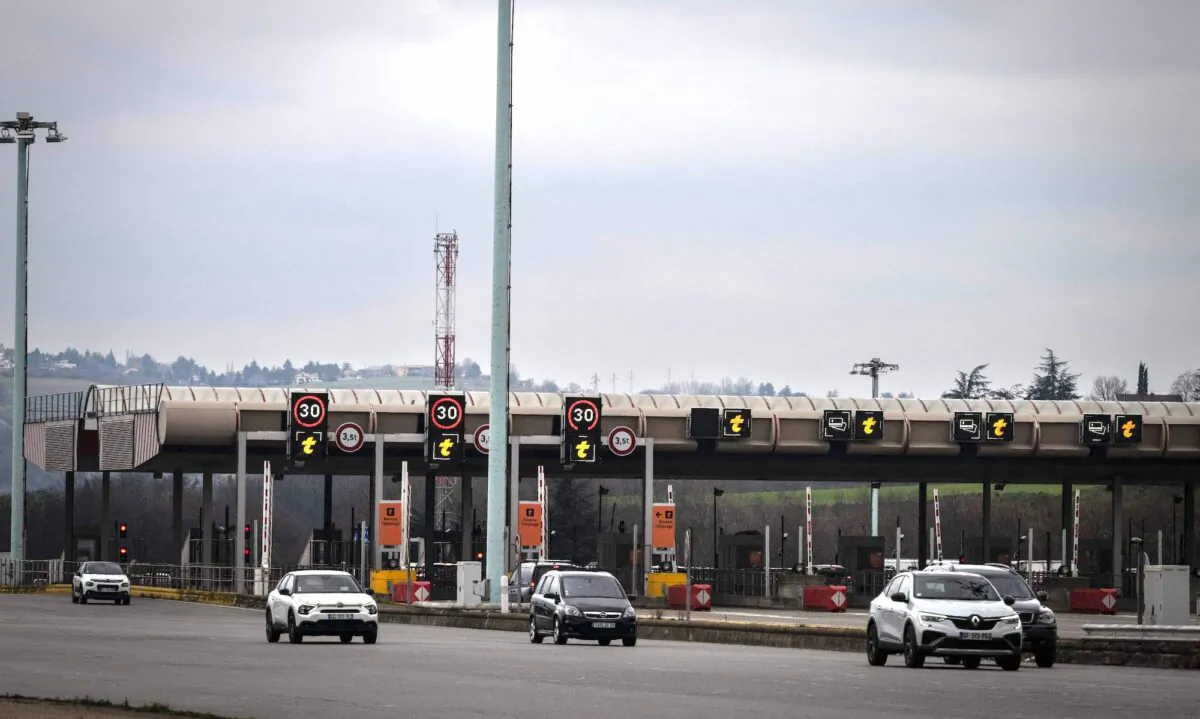Vehicles pass by the Vienne-Reventin toll gate on the A7 freeway in Reventin-Vaugris, France, on Jan. 27, 2023. (Jean-Philippe Ksiazek/AFP via Getty Images)