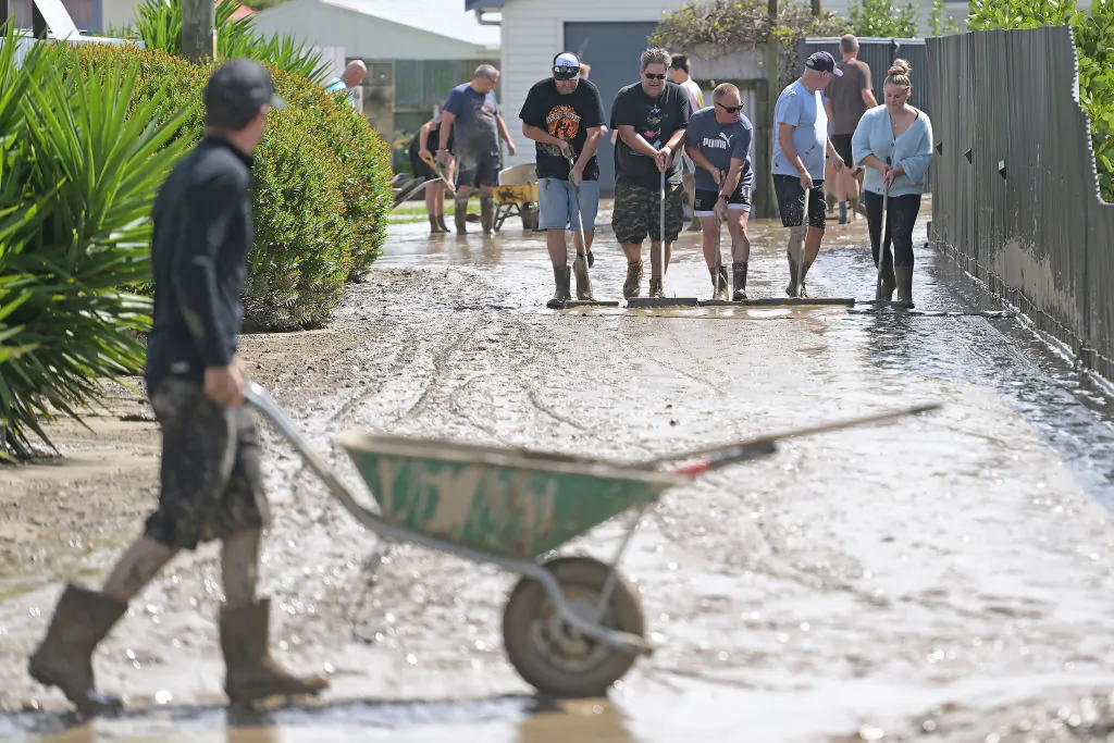 Residents in Taradale clean up silt following flood waters in Napier, New Zealand, on Feb. 15, 2023. (Kerry Marshall/Getty Images)