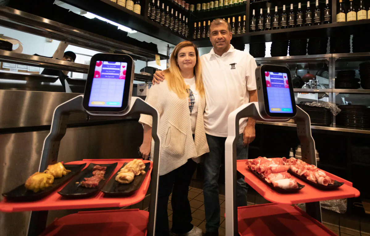 Beran Karaaslan (L) and Esat Karaaslan at I Can Korean Barbeque in Tustin, Calif., on Feb. 14, 2023. (John Fredricks/The Epoch Times)