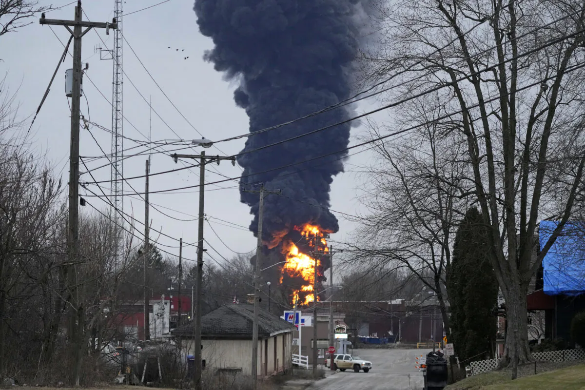 A black plume rises over East Palestine, Ohio, as a result of a controlled detonation of a portion of the derailed Norfolk Southern trains, on Feb. 6, 2023. (Gene J. Puskar/AP Photo)
