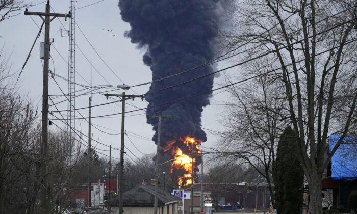 A black plume rises over East Palestine, Ohio, as a result of a controlled detonation of a portion of the derailed Norfolk Southern trains, on Feb. 6, 2023. (Gene J. Puskar/AP Photo)