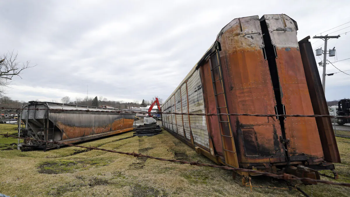 Some of the derailed railcars from when a Norfolk Southern freight train derailed are in the process of being cleaned up in East Palestine, Ohio, on Feb. 9, 2023. (Gene J. Puskar/AP Photo)