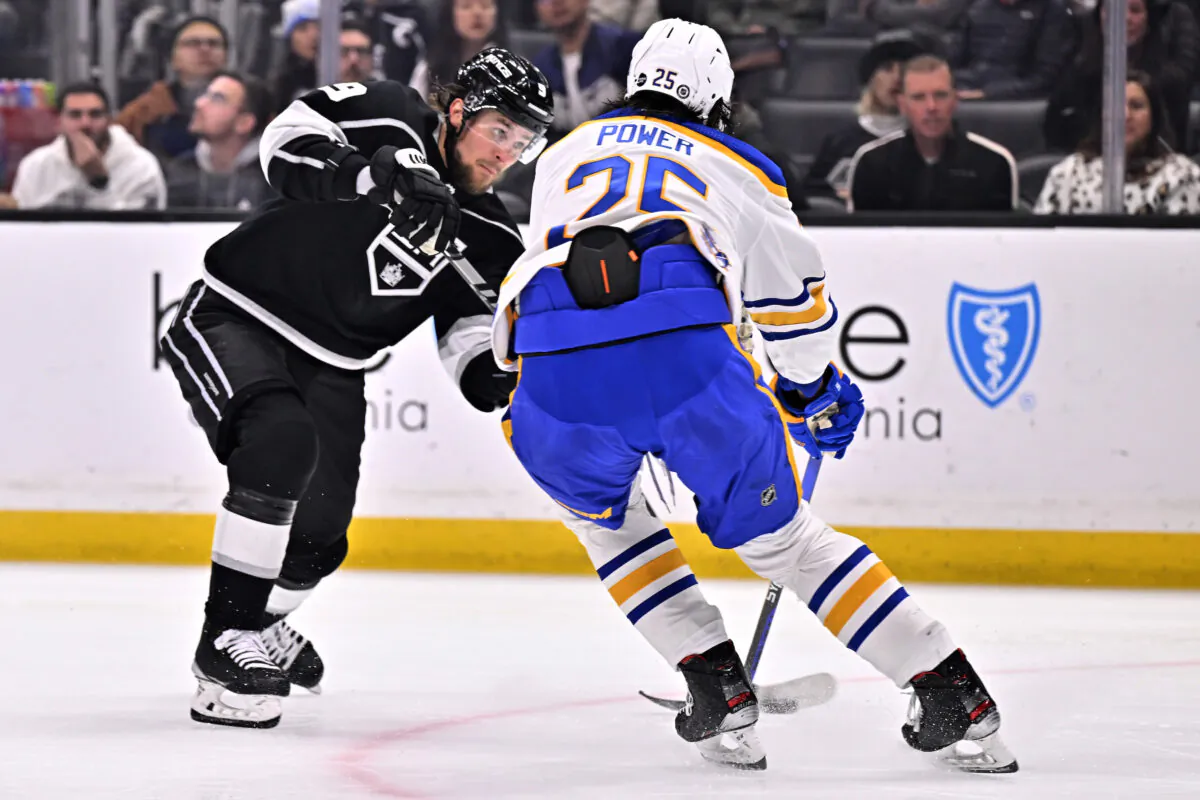 Los Angeles Kings right wing Adrian Kempe, left, shoots to score against Buffalo Sabres defenseman Owen Power during the second period of an NHL hockey game in Los Angeles on Feb. 13, 2023. (Alex Gallardo/AP Photo)