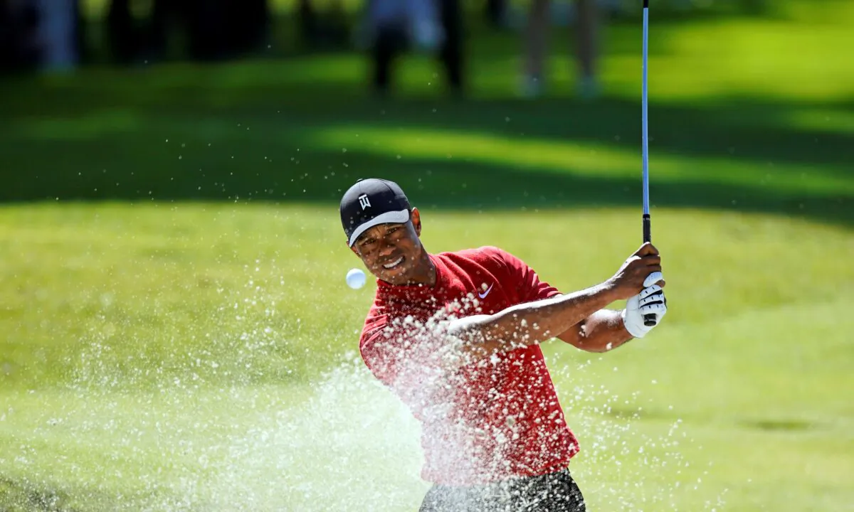 Tiger Woods hits out of a greenside bunker on the 17th hole during the final round of the Genesis Invitational golf tournament at Riviera Country Club, in the Pacific Palisades area of Los Angeles on Feb. 16, 2020. (Ryan Kang/AP Photo)
