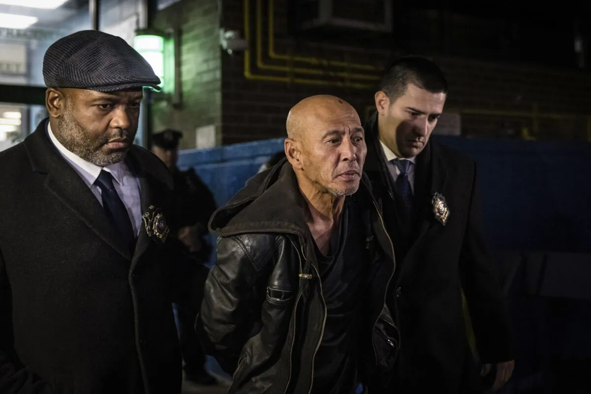 Weng Sor is walked by New York Police Department detectives out of the 68th Precinct in the Brooklyn borough of New York on Feb. 14, 2023. (Stefan Jeremiah/AP Photo)