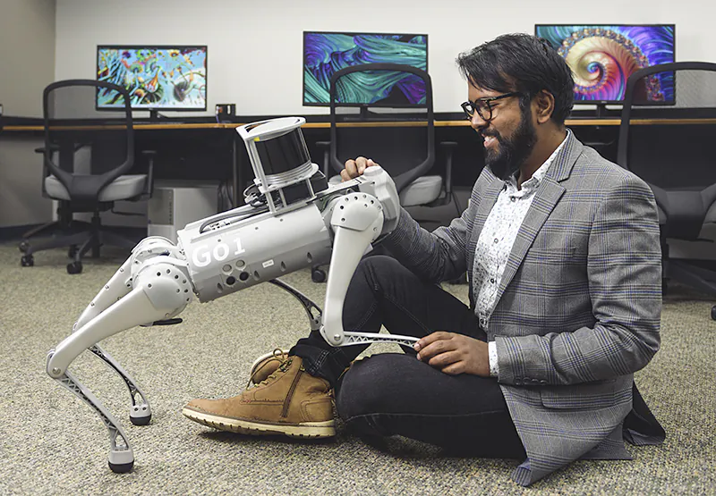 A computer lab is using virtual therapy, autonomous vehicles, and rescue bots like this robot dog to bridge the gap between humans and machines. (Rebecca McElhoe/Purdue University)