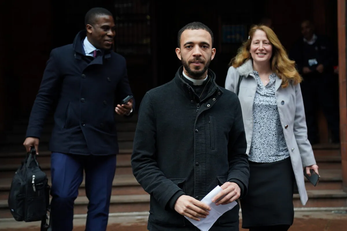 Father Sean Gough (centre), a Catholic priest of the Archdiocese of Birmingham, and Isabel Vaughan-Spruce at Birmingham Magistrates' Court where they are accused of protesting outside an abortion clinic inside a Birmingham abortion facility censorship zone. (PA Media)