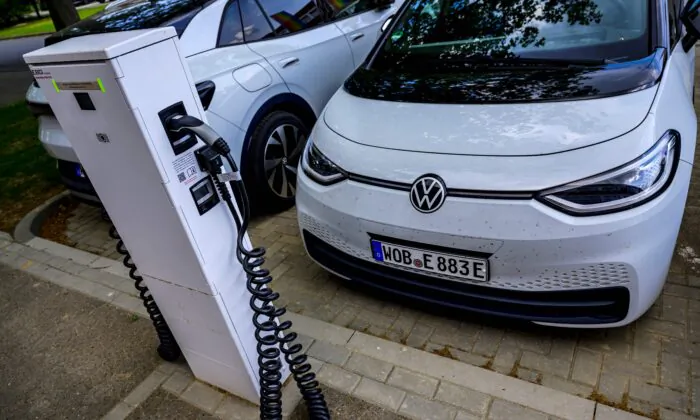 A Volkswagen electric car is parked in front of a charging station in Salzgitter, north-central Germany, on May 18, 2022. (John Macdougall/AFP via Getty Images)