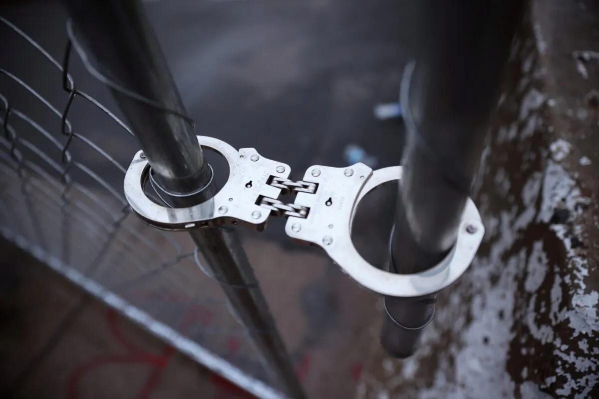 File photo of handcuff on April 12, 2021. (Scott Olson/Getty Images)