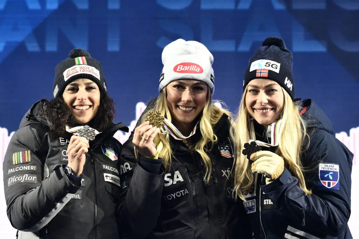 Silver medalist Italy's Federica Brignone (L), gold medalist US Mikaela Shiffrin and Bronze medalist Norway's Ragnhild Mowinckel celebrate during the award ceremony for the Women's Giant Slalom event of the FIS Alpine Ski World Championship 2023 in Meribel, French Alps, on February 16, 2023. (Jeff Pachoud/AFP via Getty Images)