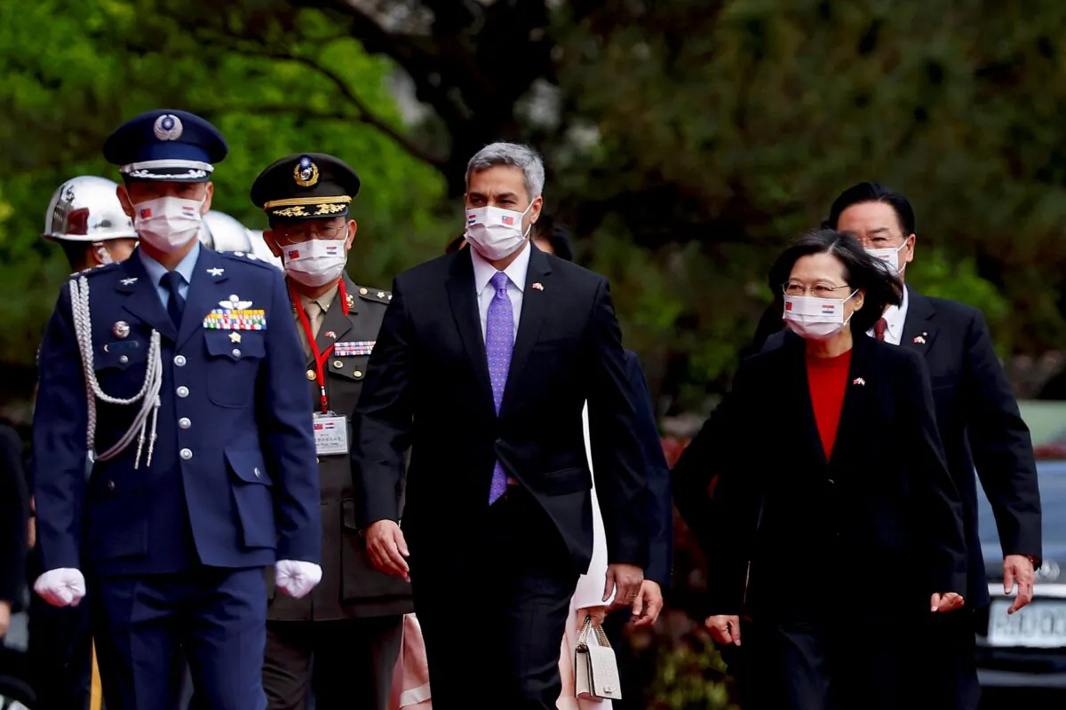 Taiwan President Tsai Ing-wen and visiting Paraguay President Mario Abdo Benitez arrive at the welcome ceremony in front of the Presidential building in Taipei, Taiwan, on Feb. 16, 2023. (Ann Wang/Reuters)