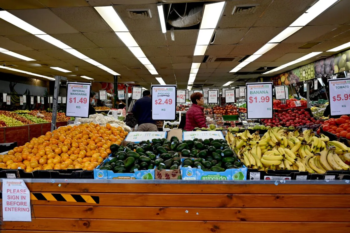 People shop at a market in Sydney, Australia, on April 27, 2022. (Saeed Khan/AFP via Getty Images)
