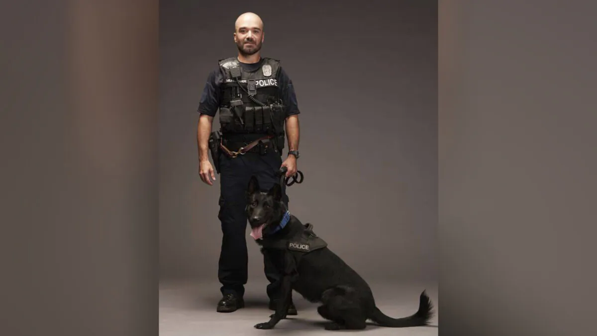 Police Officer James Muhlbauer and K-9 Officer Champ. Muhlbauer. (Kansas City Police Department via AP)