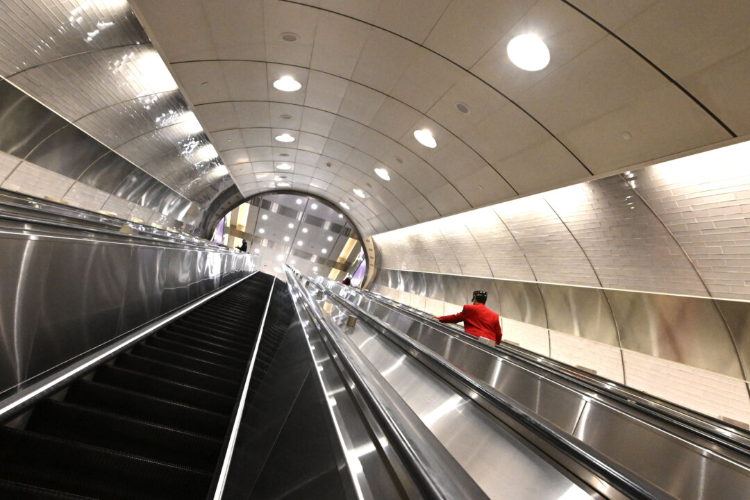 A person takes the escalator in the new Grand Central Madison Terminal in New York on Jan. 26, 2023. The MTA unveiled the new $11 billion Grand Central Madison terminal on Jan. 25, which links the Long Island Rail Road to the east side of Manhattan. (Timothy A. Clary/AFP/Getty Images/TNS)