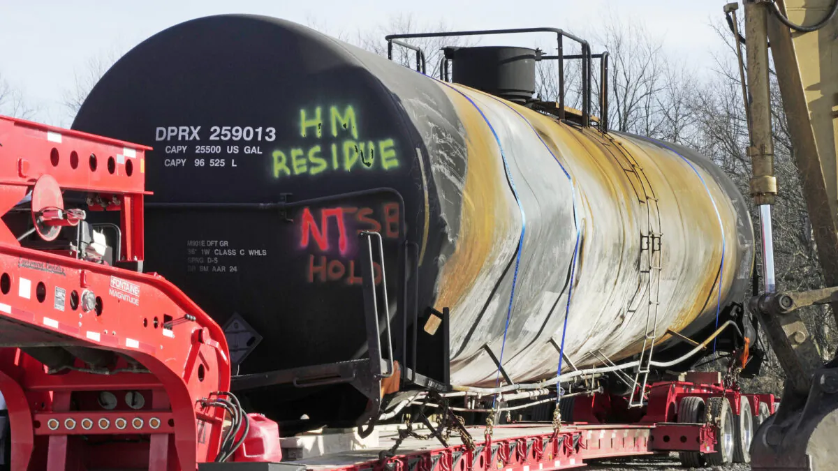 A tank car sits on a trailer as the cleanup of portions of a Norfolk Southern freight train that derailed over a week ago continues in East Palestine, Ohio, on Feb. 15, 2023. (Gene J. Puskar/AP Photo)