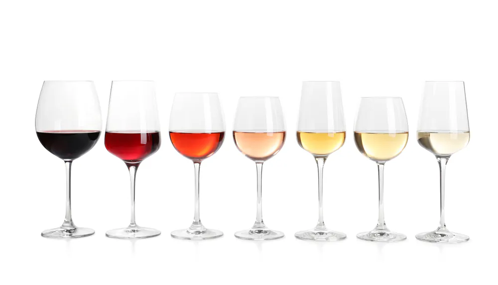 Sample wines from various regions and countries to learn how weather patterns and soil affect grapes and the resulting wines. (New Africa/Shutterstock)