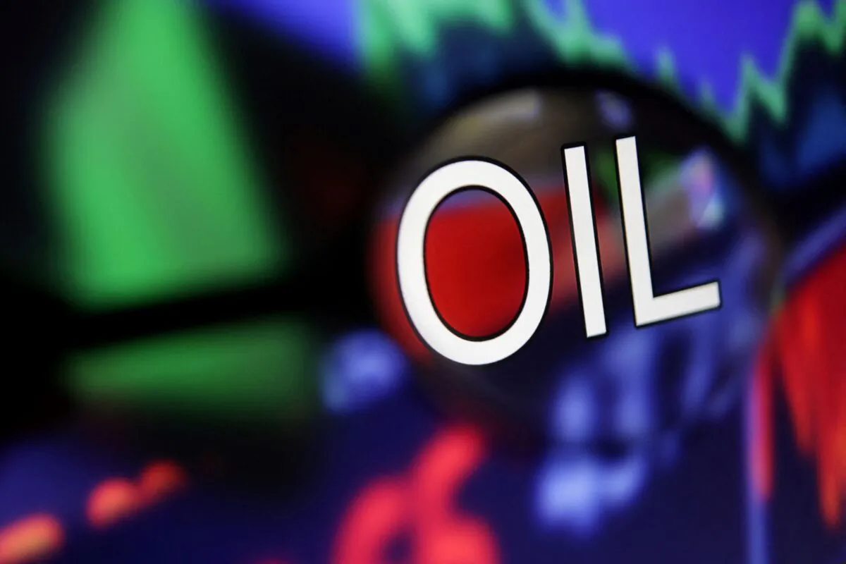 Word "Oil" and stock graph are seen through magnifier displayed in this illustration taken on Sept. 4, 2022. (Dado Ruvic/Illustration/Reuters)