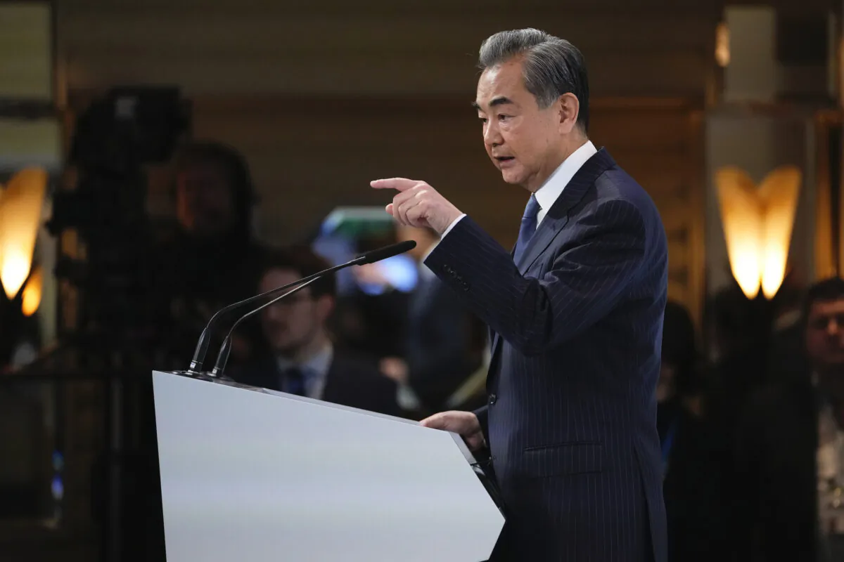 The Chinese communist regime’s foreign minister, Wang Yi, speaks at the Munich Security Conference in Germany, on Feb. 18, 2023. (Petr David Josek/AP Photo)