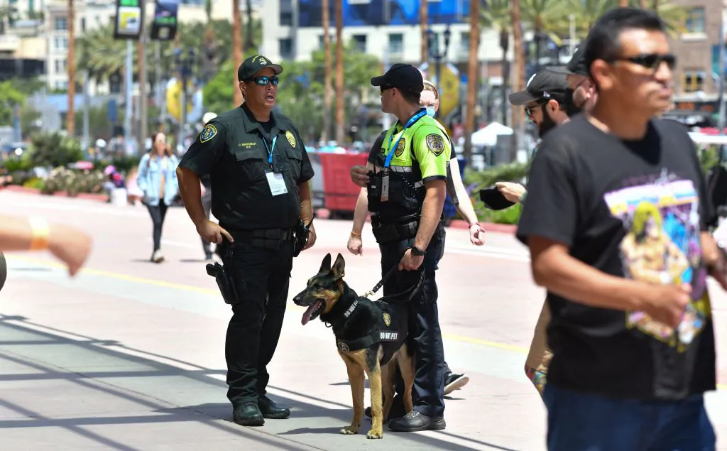 Police officers from the K-9 unit patrol in front of the convention center during San Diego Comic Con International on July 24, 2022. (Chris Delmas/AFP via Getty Images)