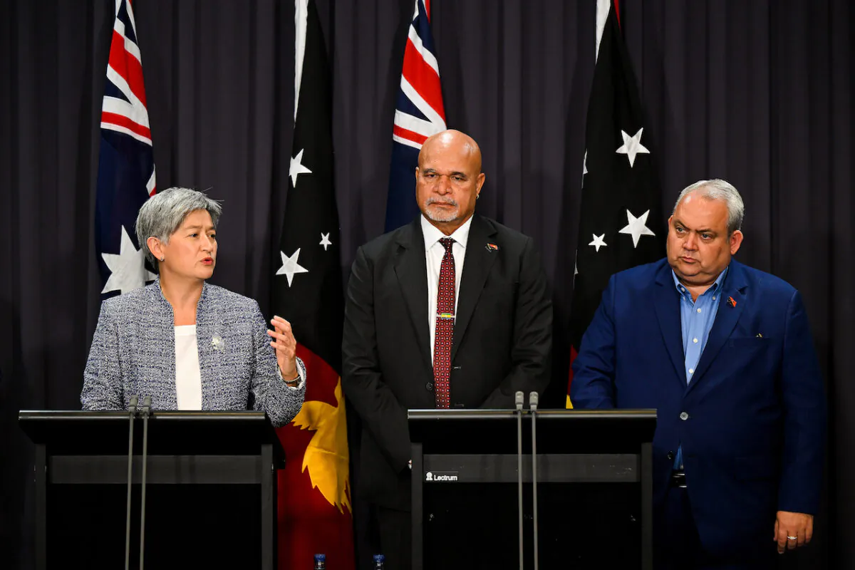 (L-R) Australian Foreign Minister Penny Wong, Deputy Prime Minister of PNG John Rosso and Foreign Minister of PNG Justin Tkatchenko speak during a press conference following the Australia-Papua New Guinea Ministerial Forum at Parliament House in Canberra, Feb. 17, 2023. (AAP Image/Lukas Coch)