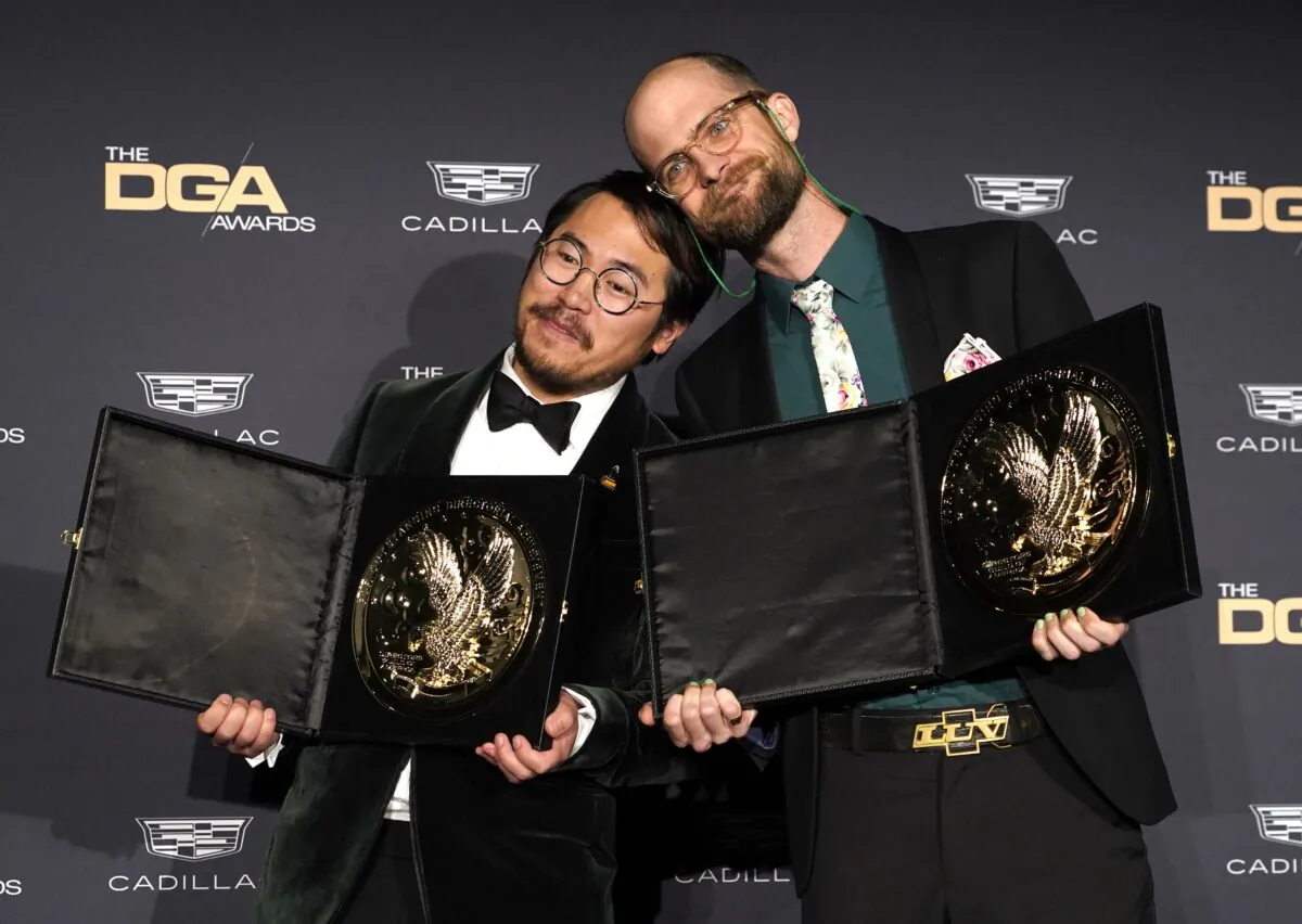 Daniel Kwan (L) and Daniel Scheinert pose in the press room with the award for outstanding directorial achievement in a theatrical feature film for "Everything Everywhere All at Once" at the 75th annual Directors Guild of America Awards at the Beverly Hilton hotel in Beverly Hills, Calif., on Feb. 18, 2023. (Chris Pizzello/AP Photo)