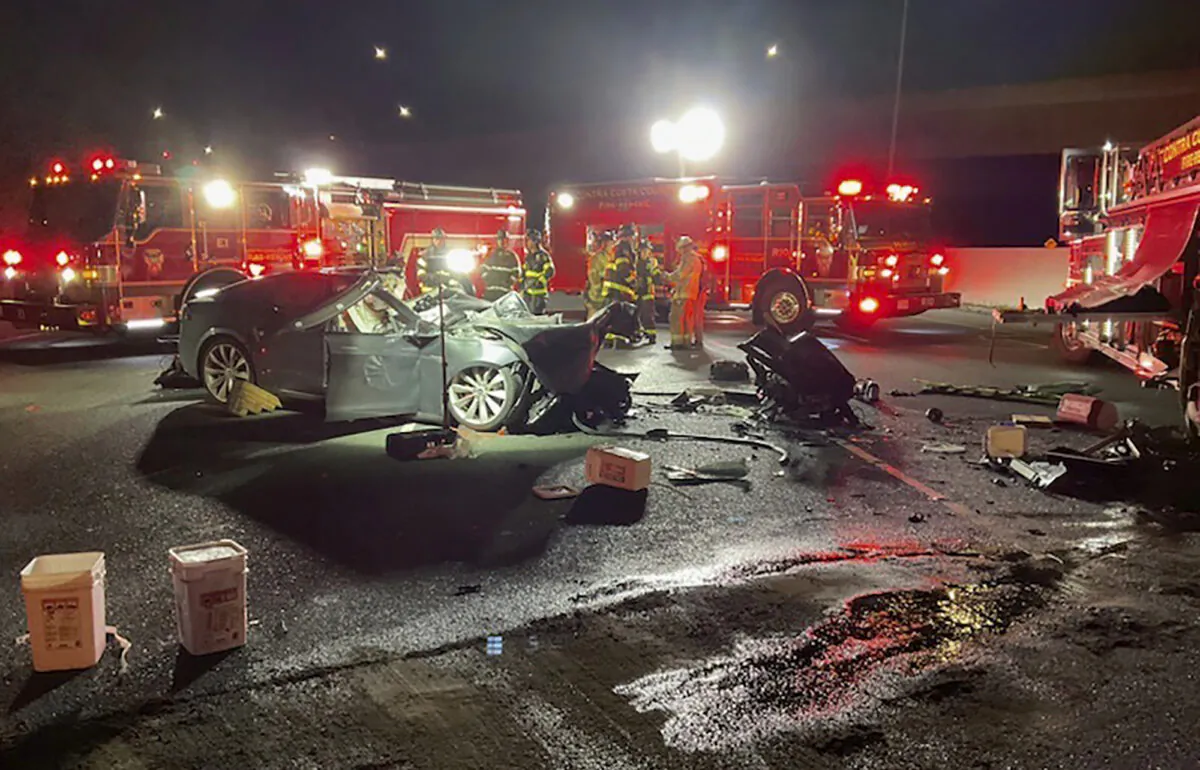 Firefighters work the scene of a fatal accident involving a Tesla and Contra Costa County fire truck in Contra Costa, Calif., on Feb. 18, 2023. (Contra Costa County Fire Protection District via AP)
