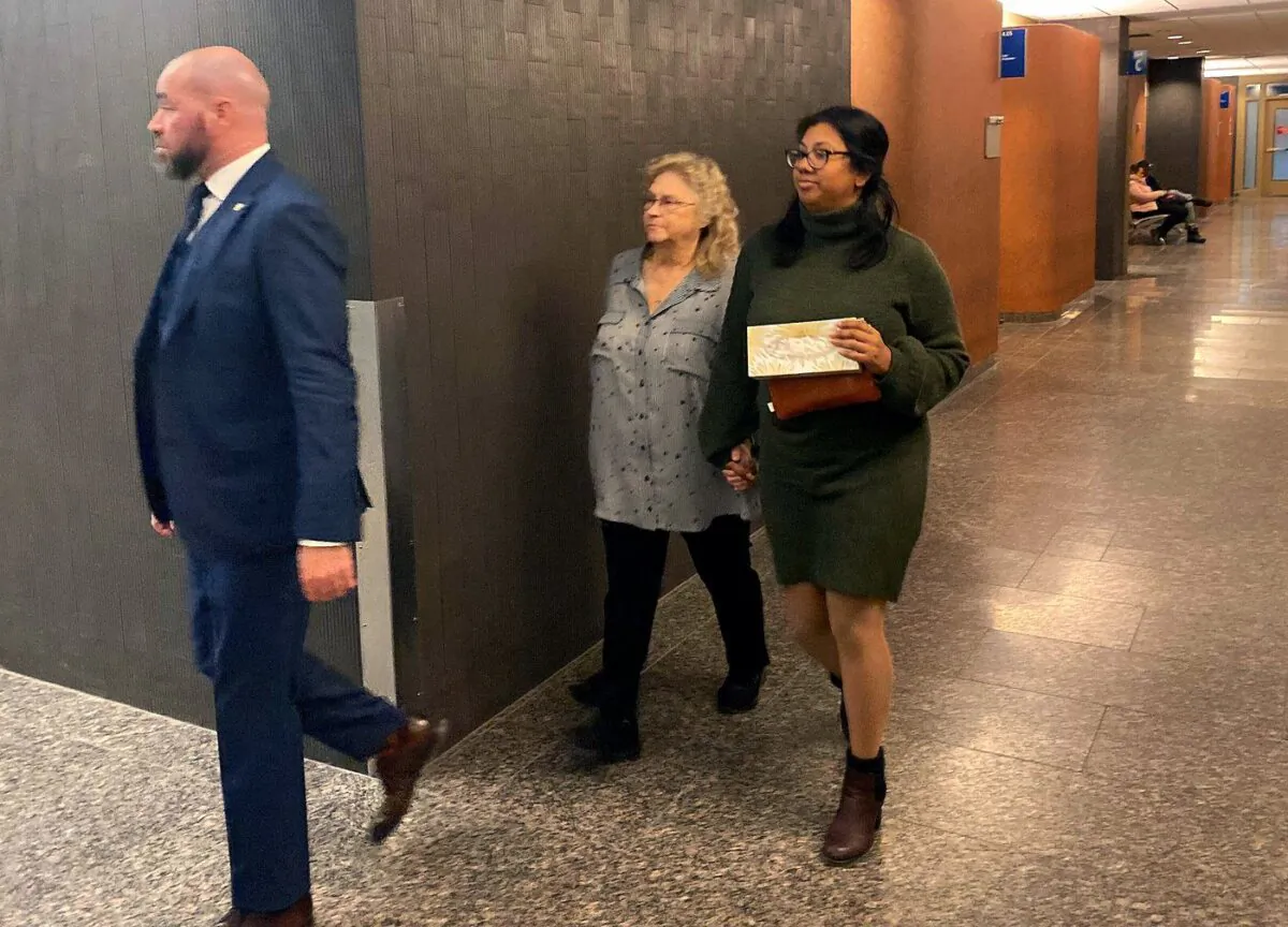 Sandra Helm walks in the hallway at the Montreal courthouse in Montreal on Jan. 18, 2023. (The Canadian Press/Sidhartha Banerjee)