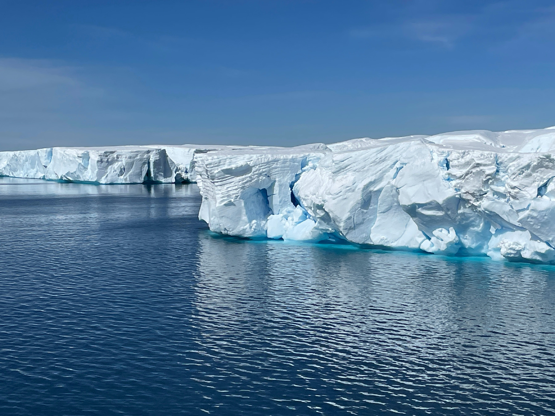 Vibrant white and blue tabular icebergs that float in the Prince Gustav Channel in Antarctica can be miles long but are quickly melting.