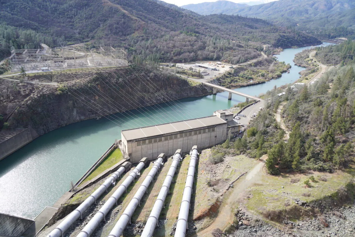Pipes on Feb. 14, 2023 were used to conduct millions of gallons of water from the 602-foot Lake Shasta Dam in Northern California. (Allan Stein/The Epoch Times)