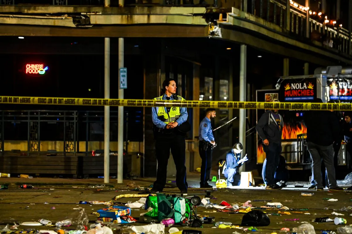 Police officers collect evidence at the scene of a shooting that occurred during the Krewe of Bacchus parade in New Orleans, on Feb. 19, 2023. (Chandan Khanna/AFP/Getty Images)