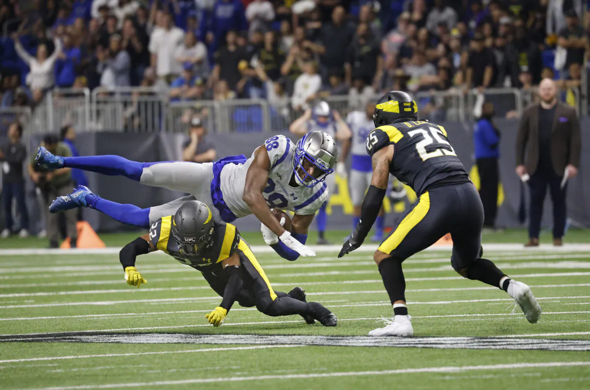 Hakeem Butler (88) of the St. Louis Battlehawks is upended by Anthony Texada (22) of the San Antonio Brahmas at the Alamodome in San Antonio on Feb. 19, 2023.  (Ronald Cortes/Getty Images)