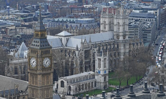 The Great Clocks of the Elizbeth Tower, commonly known as the Big Ben, and part of the House of Commons, (L) is pictured in front of Westminster Abbey in central London, on March 29, 2017. (Justin Tallis/AFP via Getty Images)