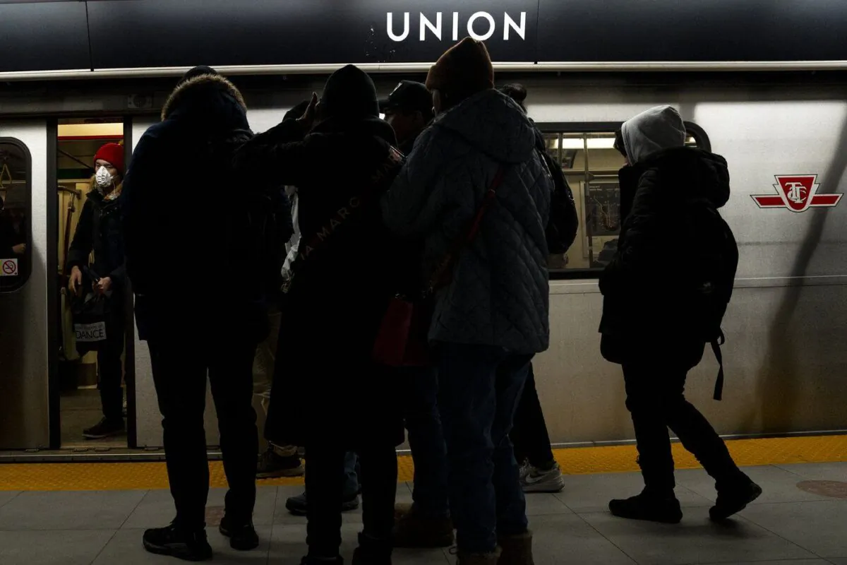 Passengers wait to board a subway car in Toronto on Jan. 27, 2023. (The Canadian Press/Chris Young)