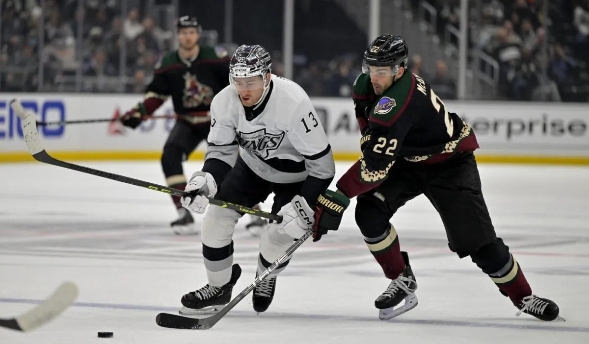 Los Angeles Kings right wing Gabriel Vilardi (13) and Arizona Coyotes center Jack McBain (22) battle for the puck in the first period Los Angeles on Feb 18, 2023. (Jayne Kamin-Oncea/USA TODAY Sports via Field Level Media)