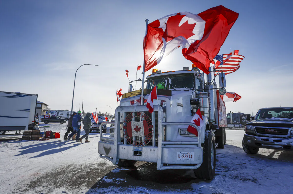 The last truck blocking the southbound lane moves after a breakthrough to resolve the impasse at a protest blockade at the Canada-U.S. border in Coutts, Alta., on Feb. 2, 2022. (Jeff McIntosh/The Canadian Press)