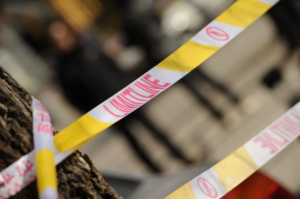 Police tape in China in a file photo. (Peter Parks/AFP via Getty Images)
