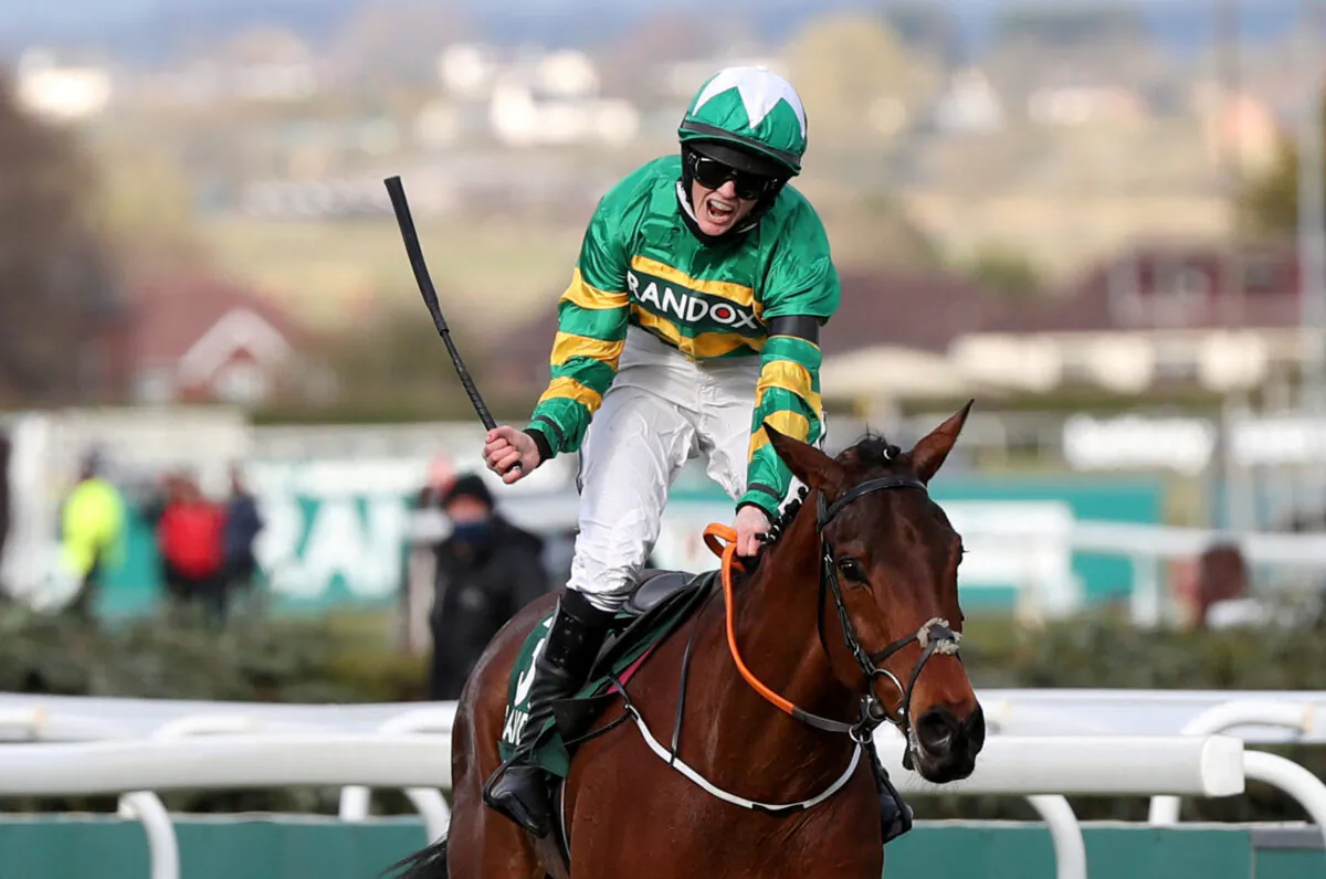 Rachael Blackmore celebrates winning the Grand National riding Minella Times during the Grand National Festival Horse Racing event at Aintree Racecourse in Liverpool, Britain, on April 10, 2021. (Scott Heppell/Pool via Reuters)