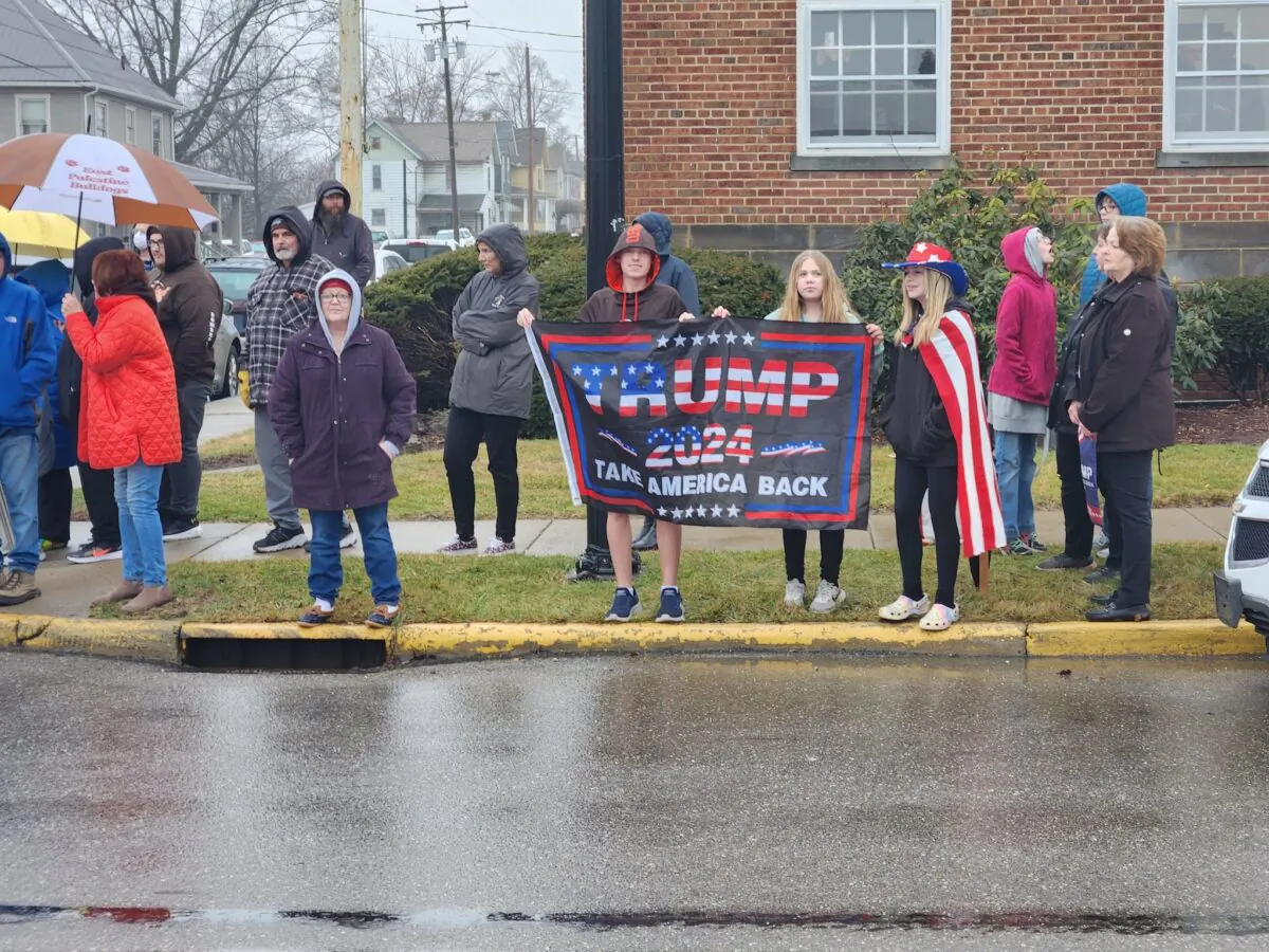 Residents await the arrival of former President Donald Trump, who visited the site of the Feb. 3 derailment of a Norfolk Southern train in East Palestine, Ohio, on Feb. 22, 2023. (Jeff Louderback/The Epoch Times)