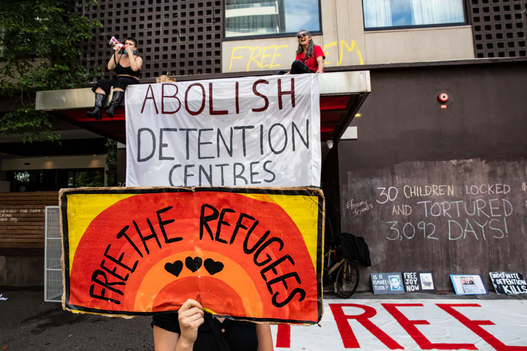 Activists in support of refugees gather outside Park Hotel in Melbourne, Australia, on Jan. 6, 2022. (Diego Fedele/Getty Images)