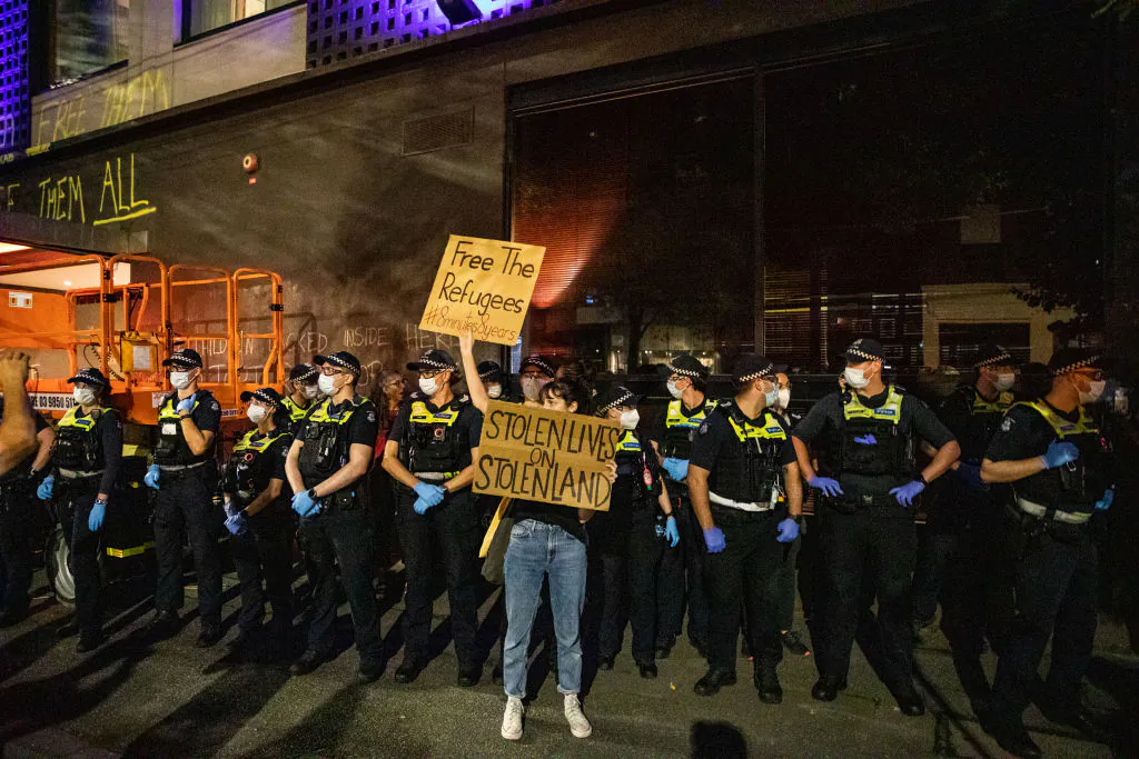 Activists in support of the refugees gather outside Park Hotel where 45 refugees are detained on Jan. 06, 2022 in Melbourne, Australia.  (Photo by Diego Fedele/Getty Images)