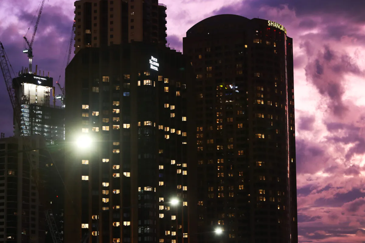 Office buildings and street lamps are seen illuminated in the central business district in Sydney, Australia, on June 21, 2022. (Lisa Maree Williams/Getty Images)