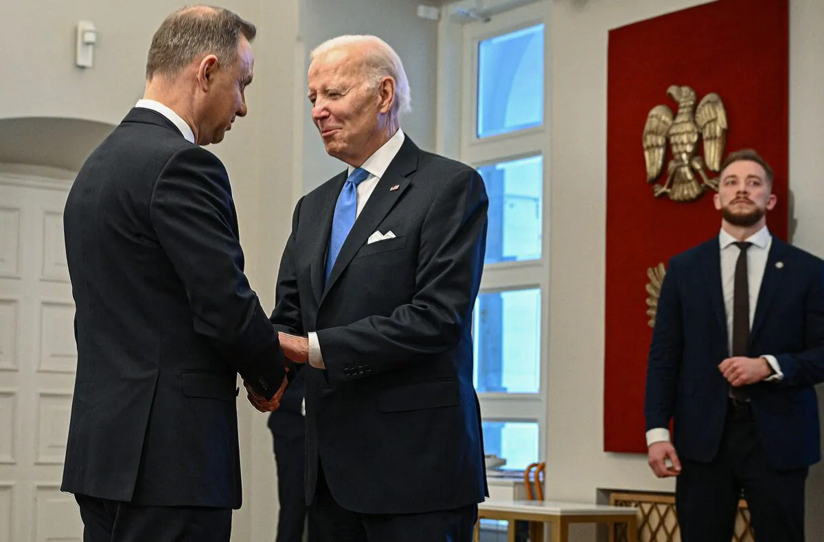 Polish President Andrzej Duda (L) welcomes U.S. President Joe Biden for the Extraordinary Summit of the NATO Bucharest Nine (B9) at the Presidential Palace in Warsaw, Poland, on Feb. 22, 2023. (Mandel Ngan/AFP via Getty Images)
