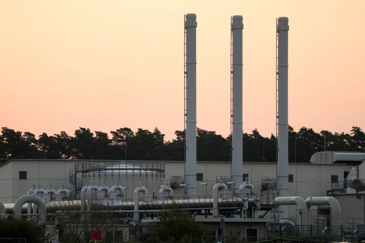 The sun rises behind the landfall facility of the Nord Stream 1 Baltic Sea pipeline and the transfer station of the OPAL gas pipeline, the Baltic Sea Pipeline Link, in Lubmin, Germany, on July 21, 2022. (Markus Schreiber/AP Photo)