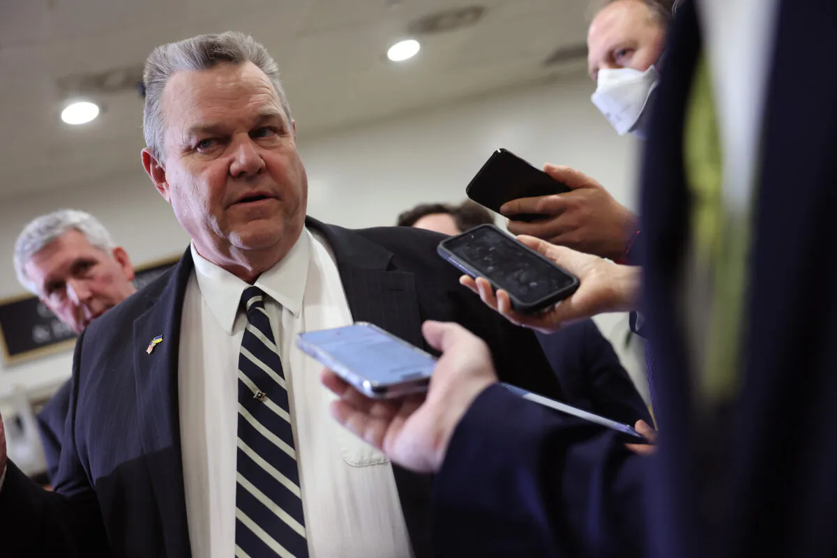 Sen. Jon Tester talks to reporters as he leaves a Senate briefing on China at the U.S. Capitol in Washington, on Feb. 15, 2023. (Kevin Dietsch/Getty Images)