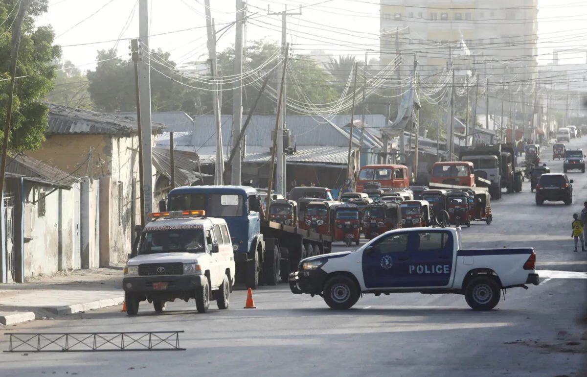Somali security forces secure the street near the scene of a militant attack at a building in Abdias district of Mogadishu, Somalia, on Feb. 21, 2023. (Feisal Omar/Reuters)