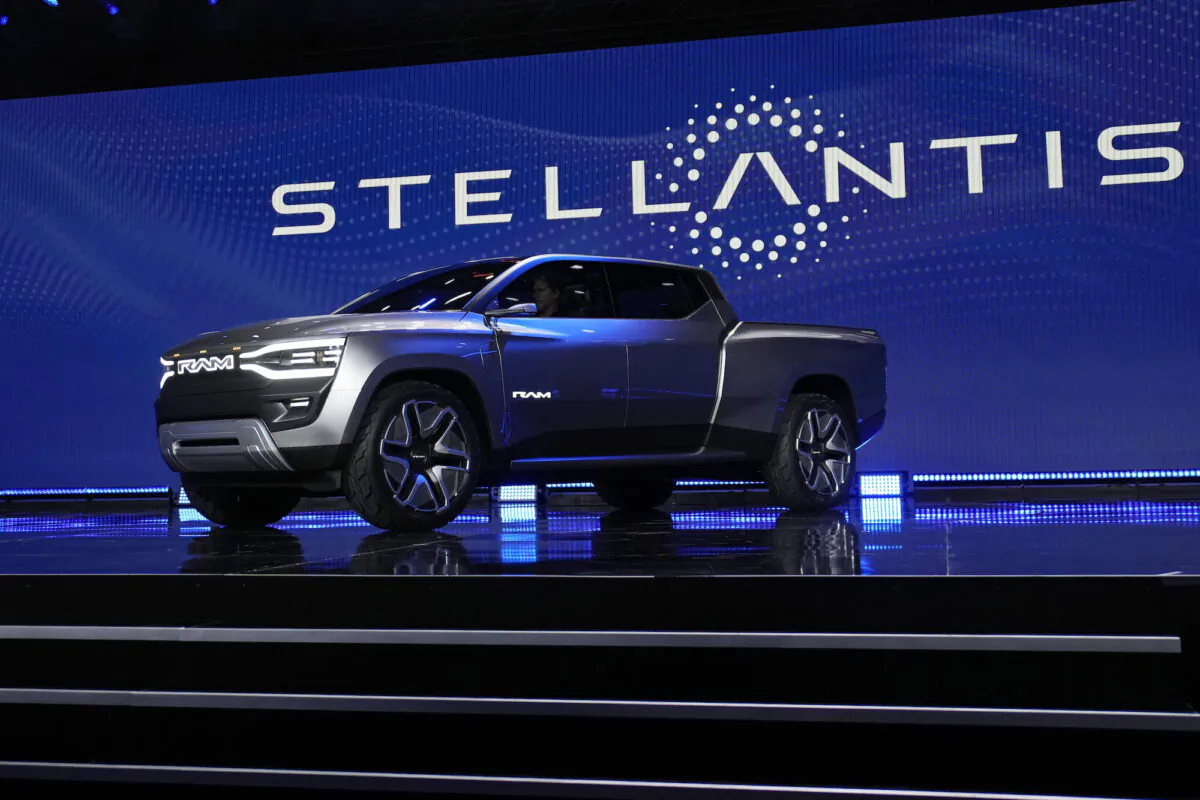 The Ram 1500 Revolution electric battery-powered pickup truck is displayed on stage during an event in Las Vegas on Jan. 5, 2023. (John Locher/AP Photo)