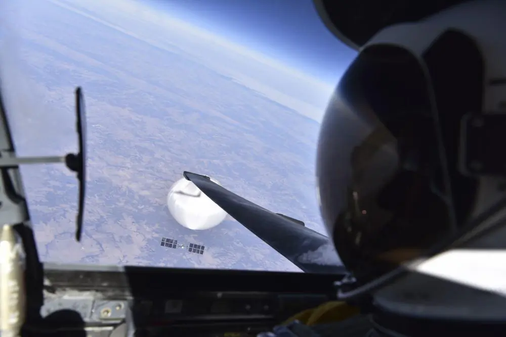 A U.S. Air Force pilot looks down at the Chinese surveillance balloon as it hovered over the central continental United States, on Feb. 3, 2023. (Courtesy of the Department of Defense)