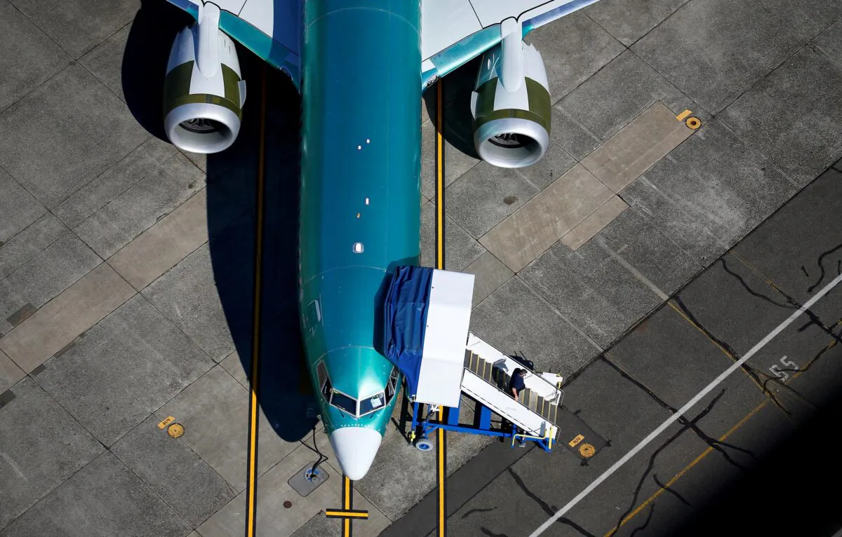 An unpainted Boeing 737 MAX aircraft is parked in an aerial photo at Renton Municipal Airport near the Boeing Renton facility in Renton, Wash., on July 1, 2019. (Lindsey Wasson/Reuters)