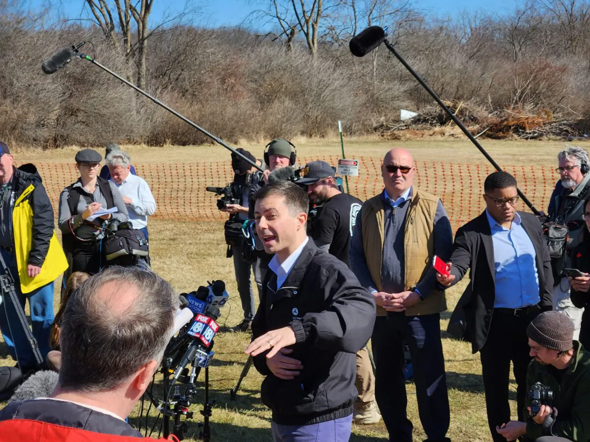Transportation Secretary Pete Buttigieg speaks with reporters in East Palestine, Ohio, on Feb. 23, 2022. (Jeff Louderback/The Epoch Times)